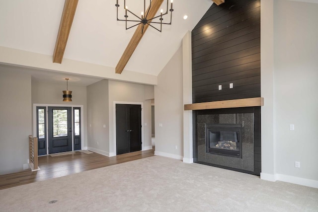 624 Green Bay Rd, Thiensville, WI 53092 - unfurnished living room featuring carpet, high vaulted ceiling, a chandelier, baseboards, and beam ceiling