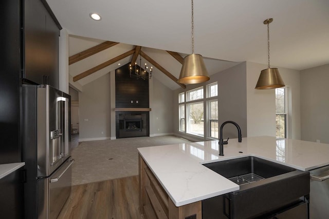 624 Green Bay Rd, Thiensville, WI 53092 - kitchen with stainless steel appliances, a sink, open floor plan, pendant lighting, and baseboards