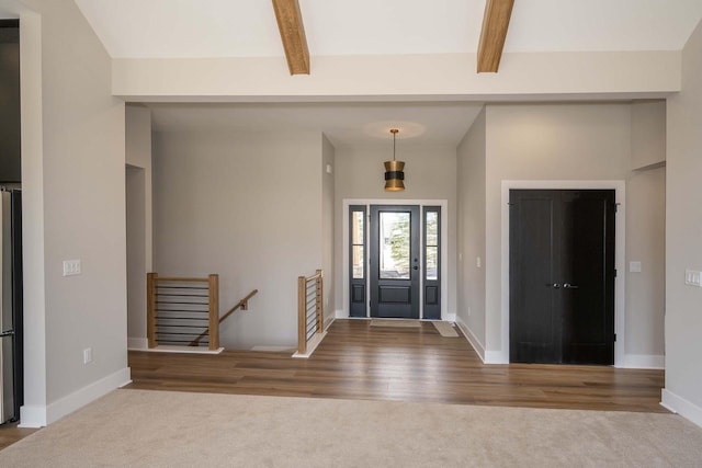 624 Green Bay Rd, Thiensville, WI 53092 - carpeted foyer featuring beamed ceiling, baseboards, and wood finished floors