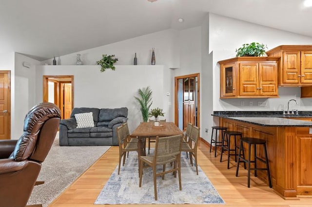 1603 Pine Tree Ln, Luxemburg, WI 54217 - dining space featuring high vaulted ceiling and light wood-type flooring