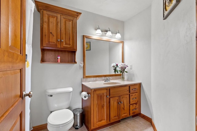 1603 Pine Tree Ln, Luxemburg, WI 54217 - bathroom featuring vanity, toilet, baseboards, and tile patterned flooring