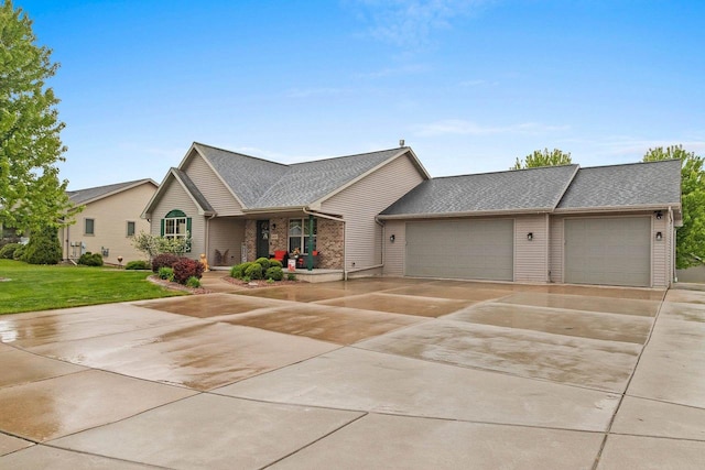 1603 Pine Tree Ln, Luxemburg, WI 54217 - view of front of house featuring a garage, driveway, a front yard, and a porch
