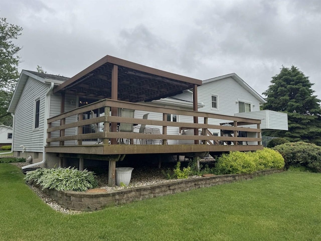 137 24th Ave, Monroe, WI 53566 - rear view of property with a yard and a wooden deck