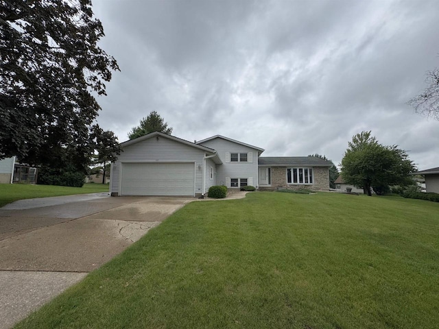 137 24th Ave, Monroe, WI 53566 - split level home with a garage, concrete driveway, and a front lawn