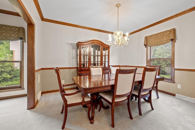 209 E Timberline Dr, Appleton, WI 54913 - dining space featuring a chandelier, light colored carpet, baseboards, and ornamental molding