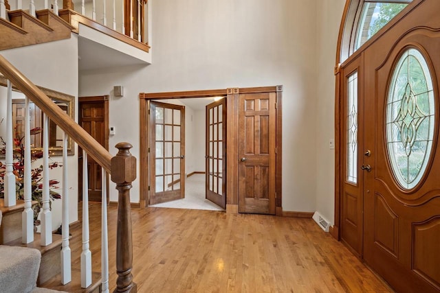 209 E Timberline Dr, Appleton, WI 54913 - entryway with a towering ceiling, stairway, light wood-style floors, baseboards, and healthy amount of natural light