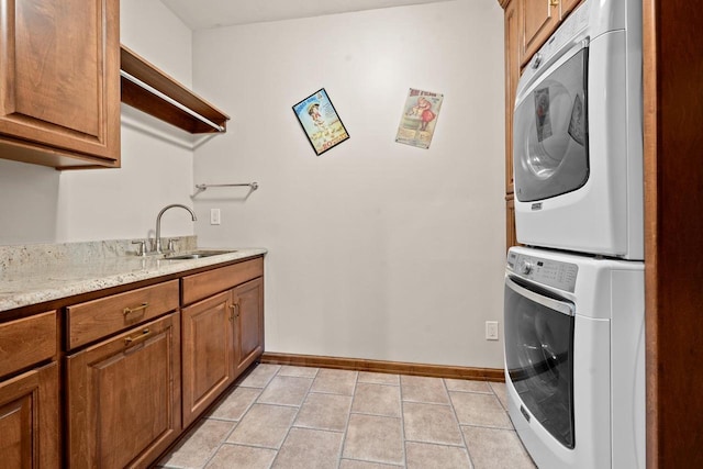 209 E Timberline Dr, Appleton, WI 54913 - washroom with stacked washer / drying machine, cabinet space, baseboards, and light tile patterned flooring