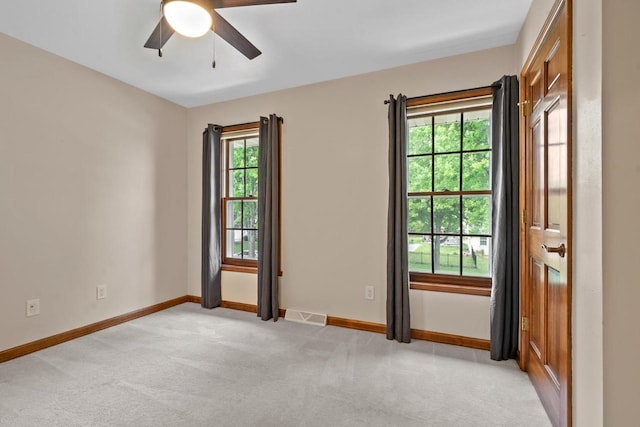 209 E Timberline Dr, Appleton, WI 54913 - spare room featuring ceiling fan, light colored carpet, and baseboards