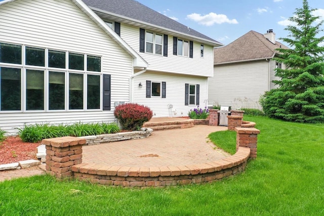 209 E Timberline Dr, Appleton, WI 54913 - rear view of house with a patio and a yard