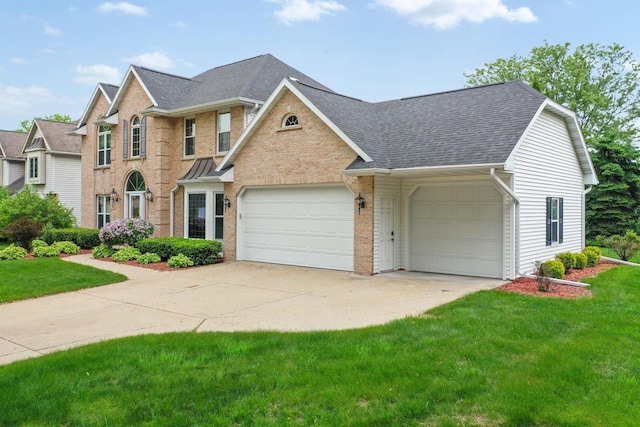 209 E Timberline Dr, Appleton, WI 54913 - view of front of property with an attached garage, roof with shingles, a front lawn, and concrete driveway