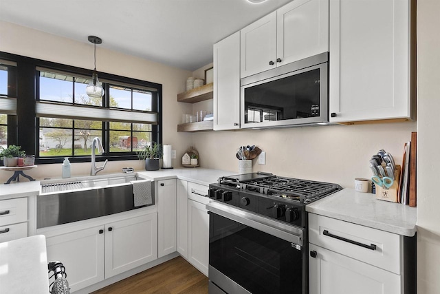 W1691 Fish Creek Rd, Seymour, WI 54165 - kitchen featuring stainless steel appliances, a sink, light countertops, and white cabinets