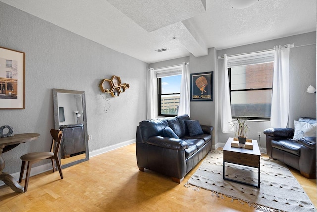 606 W Wisconsin Ave Unit 301, Milwaukee, WI 53203 - living area featuring a textured ceiling, light wood finished floors, a textured wall, and baseboards