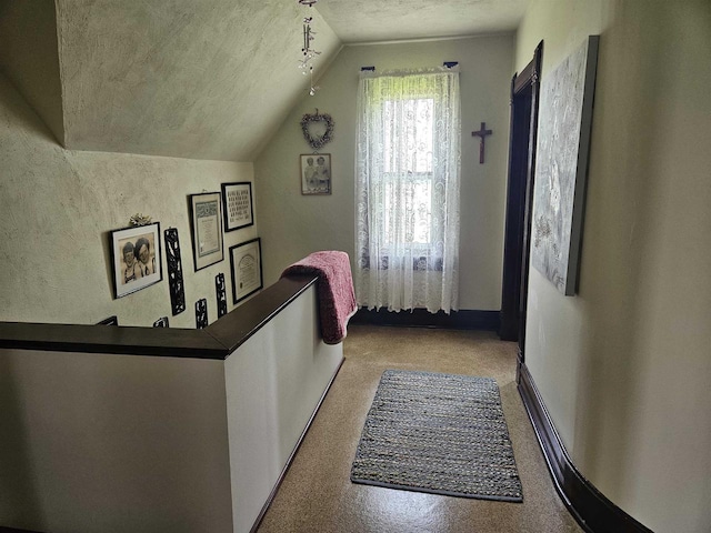 7310 Old 57 Rd, Greenleaf, WI 54126 - hallway featuring vaulted ceiling and a textured ceiling