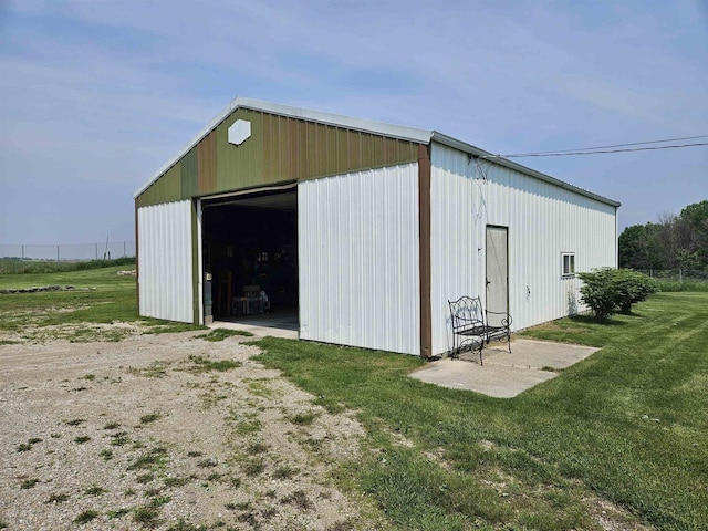 7310 Old 57 Rd, Greenleaf, WI 54126 - view of pole building featuring dirt driveway and a lawn