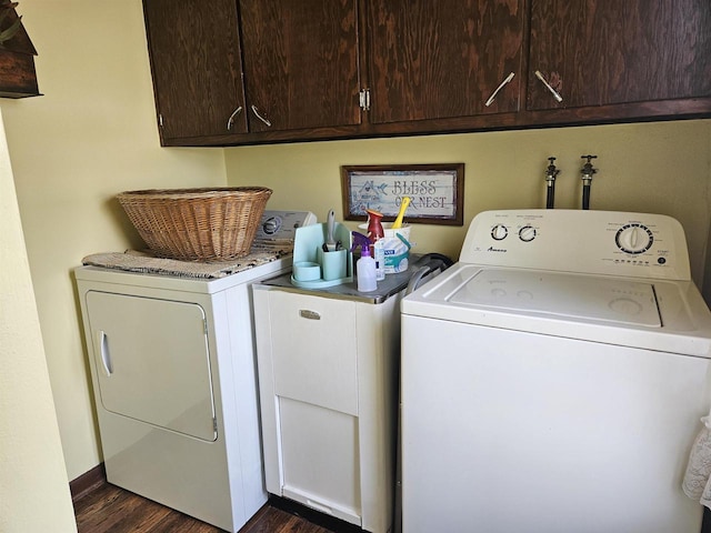7310 Old 57 Rd, Greenleaf, WI 54126 - laundry area featuring washer and dryer, cabinet space, and dark wood-style floors