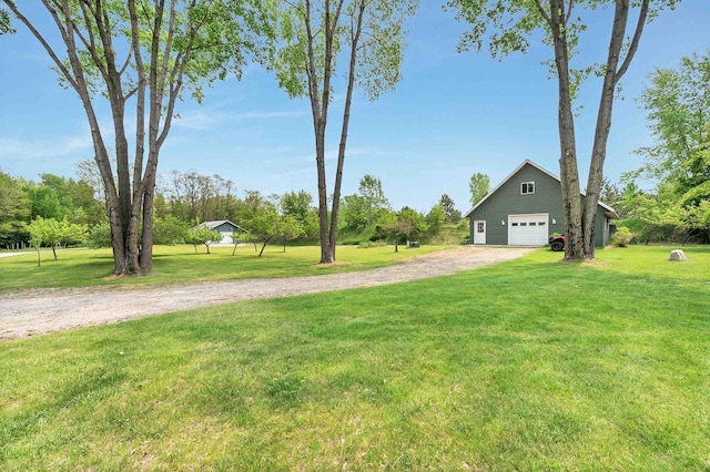 1817 Bonk Ln, Little Suamico, WI 54141 - view of grassy yard featuring a garage and driveway