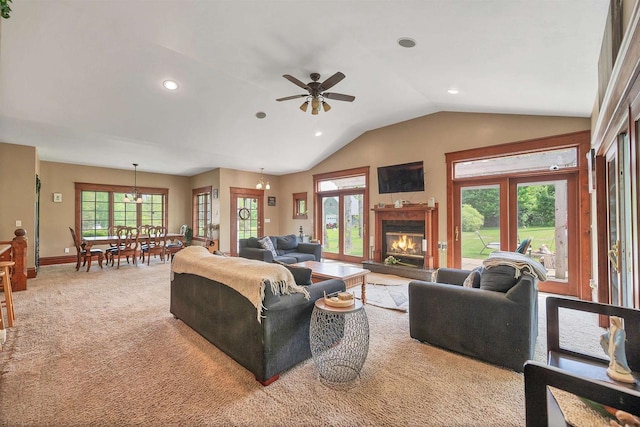 1817 Bonk Ln, Little Suamico, WI 54141 - living room with recessed lighting, lofted ceiling, a ceiling fan, a glass covered fireplace, and light carpet
