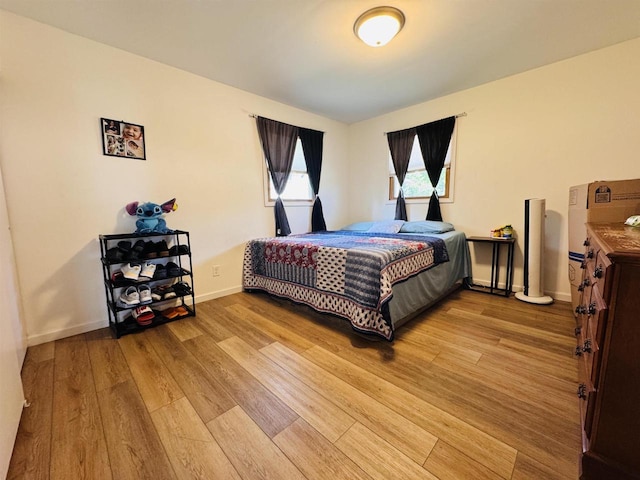 1120 4th St, Baraboo, WI 53913 - bedroom featuring light wood-style floors and baseboards