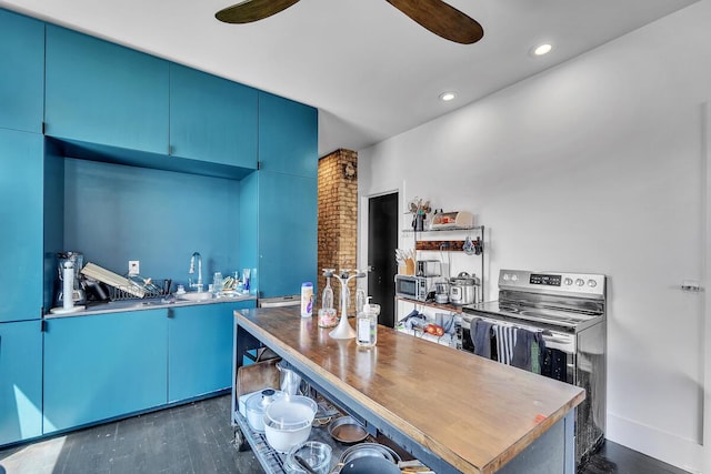 2505 N Oakland Ave Unit 2507, Milwaukee, WI 53211 - kitchen featuring dark wood-style floors, a ceiling fan, blue cabinets, recessed lighting, and stainless steel range with electric stovetop