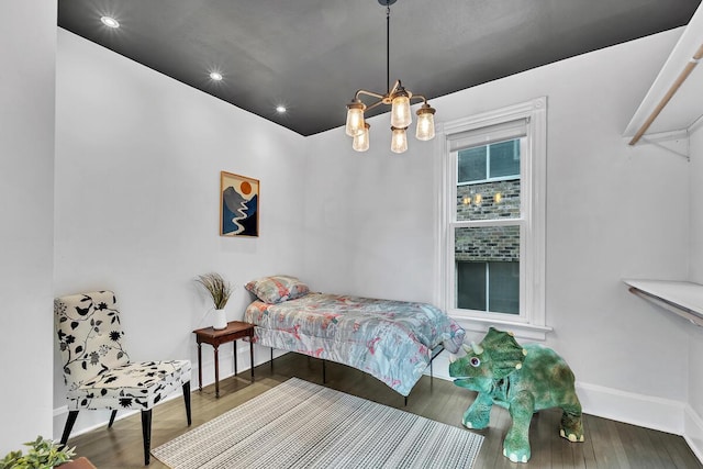 2505 N Oakland Ave Unit 2507, Milwaukee, WI 53211 - bedroom featuring a chandelier, baseboards, wood finished floors, and recessed lighting
