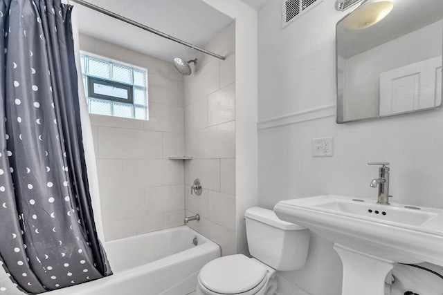 2505 N Oakland Ave Unit 2507, Milwaukee, WI 53211 - full bathroom with shower / bath combo with shower curtain, toilet, and a sink