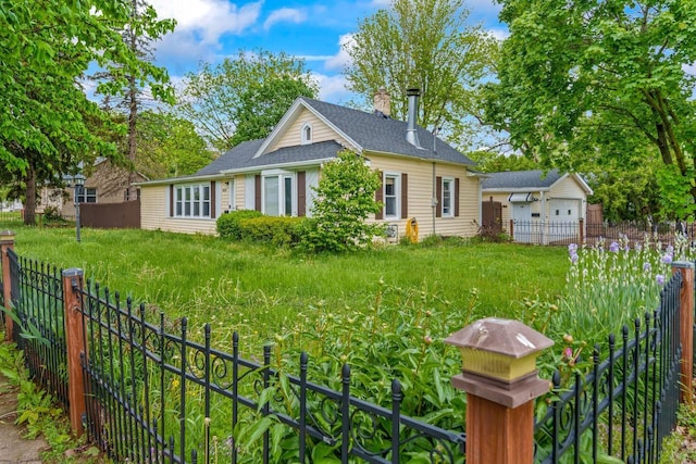 603 Spring St, Lake Geneva, WI 53147 - view of front facade with a fenced backyard, an outbuilding, and roof with shingles