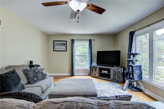 1805 Main St, Eau Claire, WI 54701 - living area with healthy amount of natural light, baseboards, a ceiling fan, and wood finished floors
