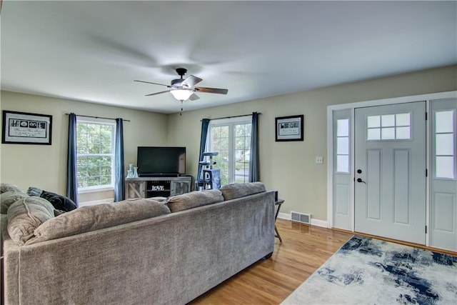 1805 Main St, Eau Claire, WI 54701 - living area featuring plenty of natural light, light wood-style floors, ceiling fan, and baseboards