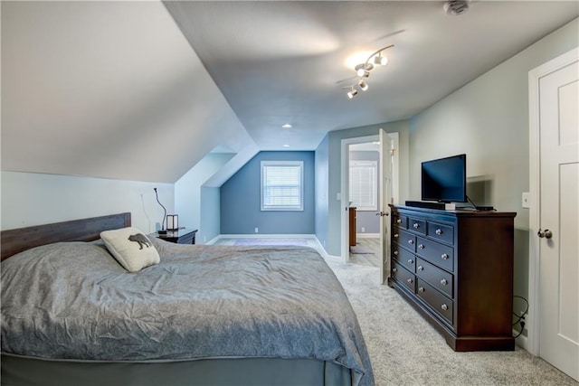 1805 Main St, Eau Claire, WI 54701 - bedroom with light colored carpet, baseboards, and lofted ceiling