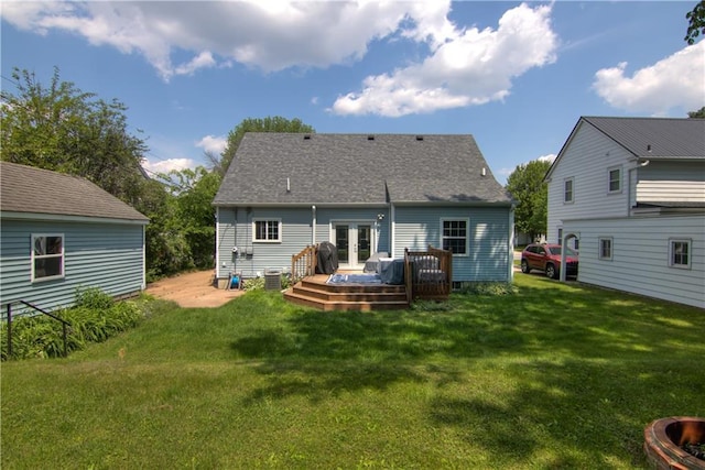1805 Main St, Eau Claire, WI 54701 - rear view of house with a deck, french doors, a yard, and central AC unit
