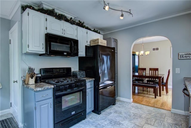 1805 Main St, Eau Claire, WI 54701 - kitchen with black appliances, arched walkways, crown molding, a chandelier, and baseboards