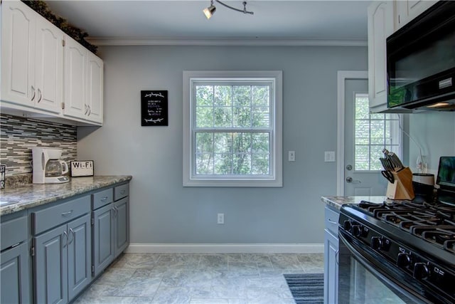 1805 Main St, Eau Claire, WI 54701 - kitchen with black appliances, ornamental molding, backsplash, baseboards, and white cabinetry