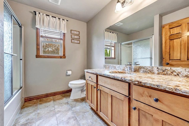 3251 Bower Creek Rd, De Pere, WI 54115 - bathroom with baseboards, vanity, toilet, and combined bath / shower with glass door