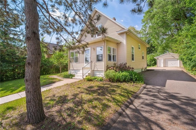 1528 Bellevue Ave, Eau Claire, WI 54703 - view of front of home with an outdoor structure, a garage, and a front yard