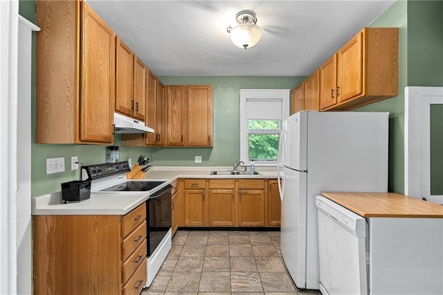1528 Bellevue Ave, Eau Claire, WI 54703 - kitchen featuring white appliances, under cabinet range hood, a sink, light countertops, and stone finish flooring