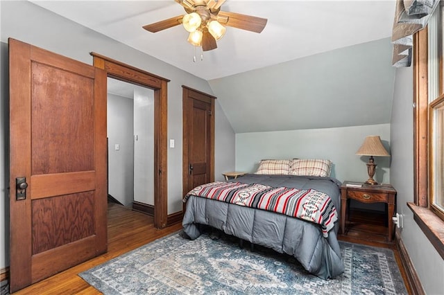 1528 Bellevue Ave, Eau Claire, WI 54703 - bedroom with wood finished floors, lofted ceiling, ceiling fan, and baseboards