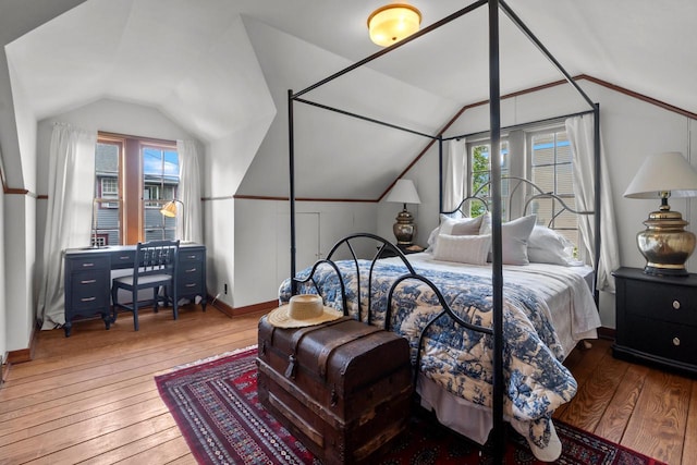 234 Warren St, Lake Geneva, WI 53147 - bedroom with vaulted ceiling, wood-type flooring, and baseboards
