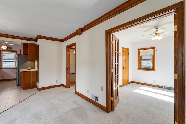 2147 S 90th St, West Allis, WI 53227 - unfurnished living room with a ceiling fan, crown molding, light carpet, and baseboards