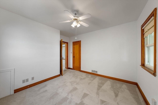 2147 S 90th St, West Allis, WI 53227 - unfurnished room with light carpet, baseboards, and ceiling fan