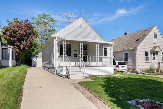 2147 S 90th St, West Allis, WI 53227 - view of front of property with a porch and a front yard