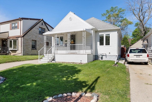 2147 S 90th St, West Allis, WI 53227 - bungalow-style house with covered porch and a front yard