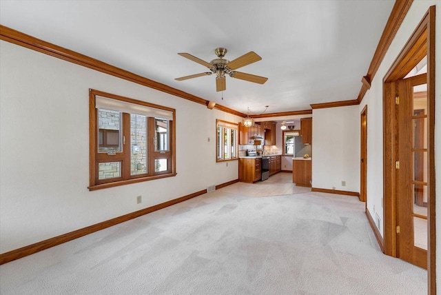 2147 S 90th St, West Allis, WI 53227 - unfurnished living room with ornamental molding, light colored carpet, ceiling fan, and baseboards