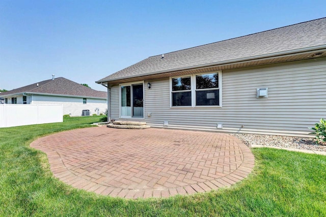 3611 Glen Kent Ct, Green Bay, WI 54313 - rear view of house with a patio, a lawn, roof with shingles, and cooling unit