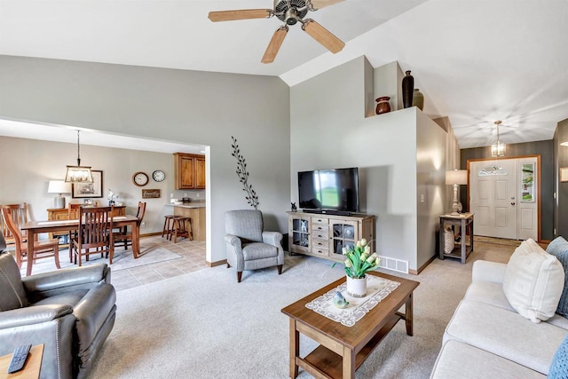 3611 Glen Kent Ct, Green Bay, WI 54313 - living room featuring light colored carpet, a ceiling fan, baseboards, and high vaulted ceiling