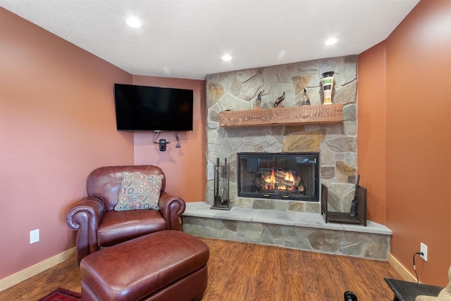 N8092 15th Ave, New Lisbon, WI 53950 - living area with baseboards, a fireplace, wood finished floors, and recessed lighting