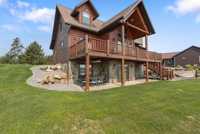 N8092 15th Ave, New Lisbon, WI 53950 - back of property with a wooden deck, a patio, a lawn, stairs, and a shingled roof