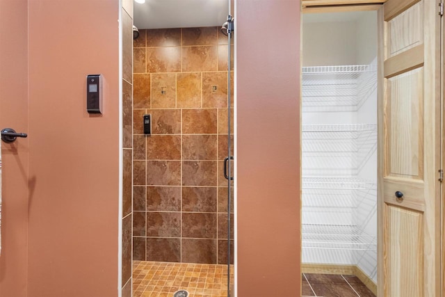 N8092 15th Ave, New Lisbon, WI 53950 - bathroom featuring a shower stall and tile patterned floors
