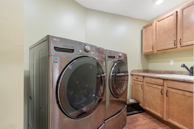 N8092 15th Ave, New Lisbon, WI 53950 - laundry room featuring washing machine and dryer, cabinet space, dark wood-style floors, and recessed lighting