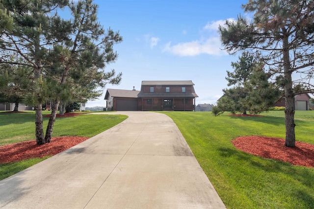 N8092 15th Ave, New Lisbon, WI 53950 - view of front facade with a garage, a front yard, and driveway