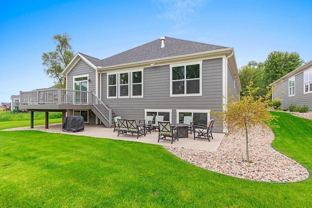5660 N Osprey Dr, Appleton, WI 54913 - rear view of property featuring a deck, a patio area, a lawn, stairway, and roof with shingles